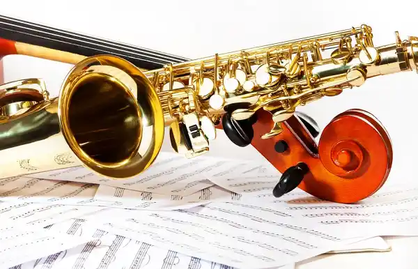 image of saxophone, cello, and sheet music